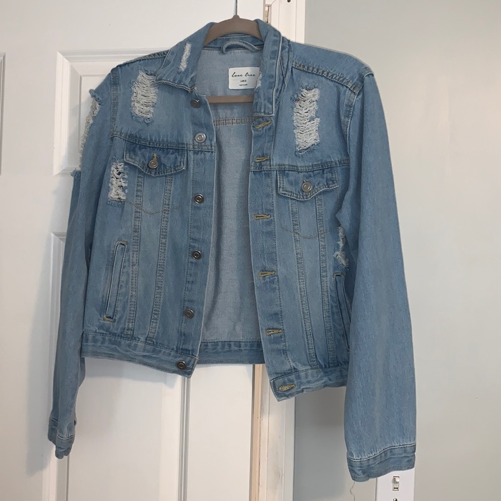 Light blue ripped jean jacket